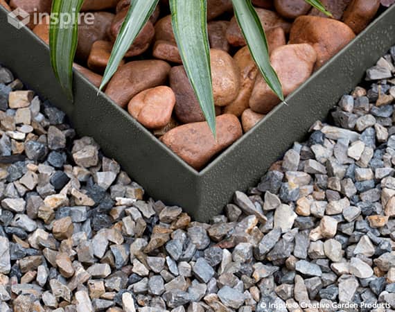Product photography of Inspire Modern Garden Edging, installed in a gravel garden.